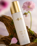 close-up face mist spray droplets glowing hydrated skin effect