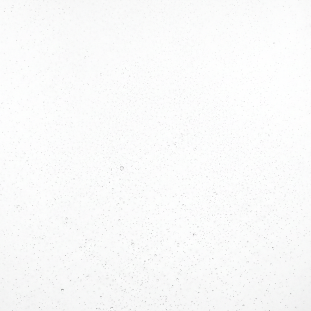 close-up face mist spray droplets glowing hydrated skin effect